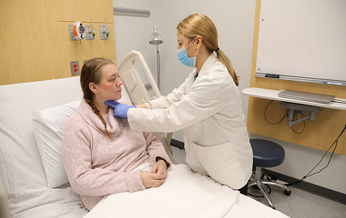 Speech-Language Pathologist with patient